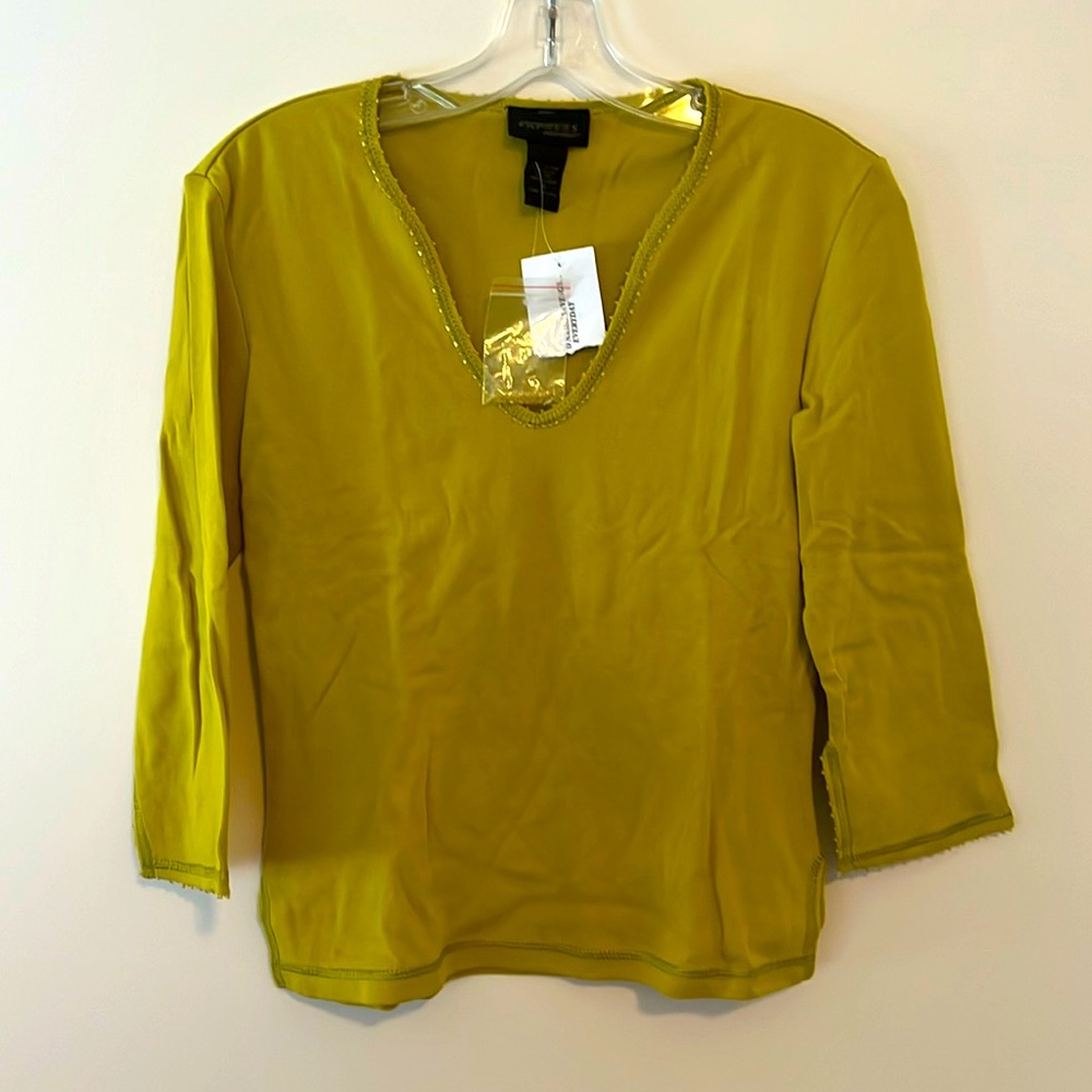 Vneck knit long sleeve women’s top with h beading on the neck and cuffs